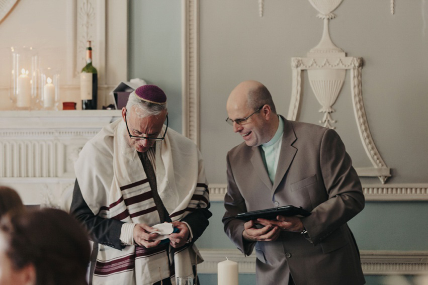 Bride Jess wears an original 1970's vintage Ossie Clarke dress for her Jewish wedding ceremony at Home House in London. Photography by Rebecca Goddard.