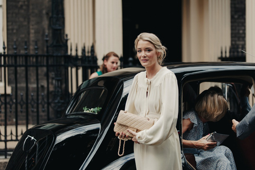 Bride Jess wears an original 1970's vintage Ossie Clarke dress for her Jewish wedding ceremony at Home House in London. Photography by Rebecca Goddard.