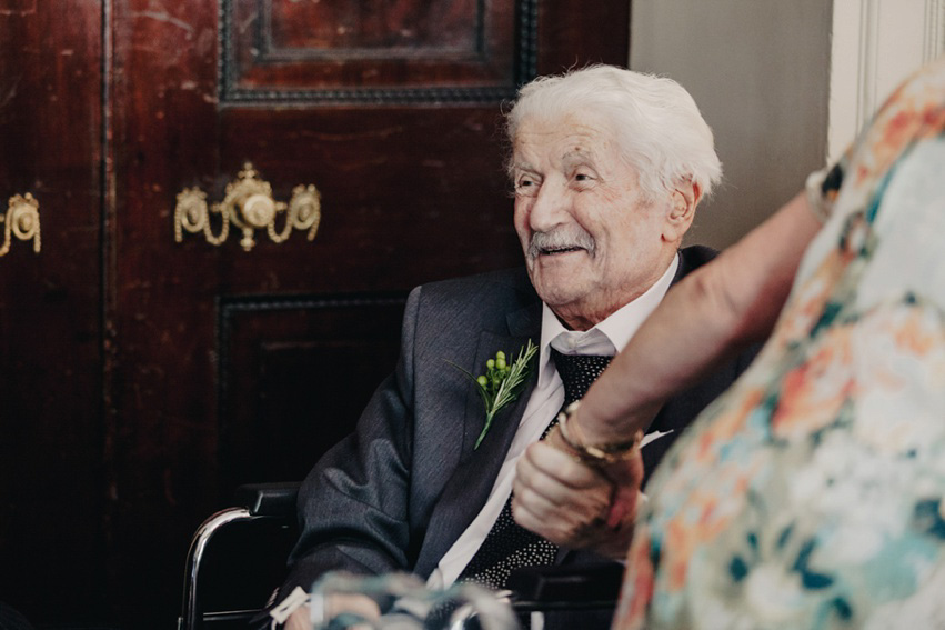 Bride Jess wears an original 1970's vintage Ossie Clarke dress for her Jewish wedding ceremony at Home House in London. Photography by Rebecca Goddard.