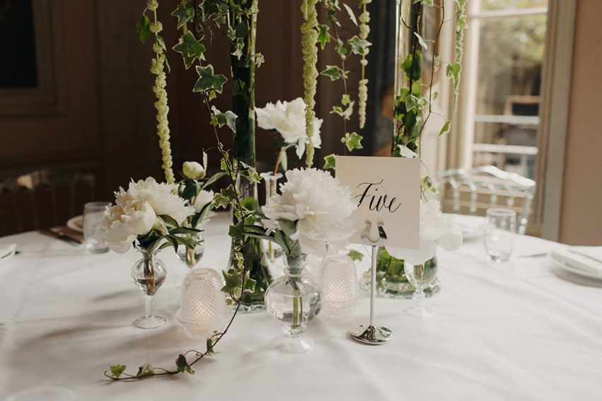 Bride Jess wears an original 1970's vintage Ossie Clarke dress for her Jewish wedding ceremony at Home House in London. Photography by Rebecca Goddard.