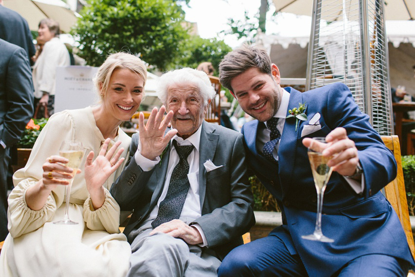 Bride Jess wears an original 1970's vintage Ossie Clarke dress for her Jewish wedding ceremony at Home House in London. Photography by Rebecca Goddard.