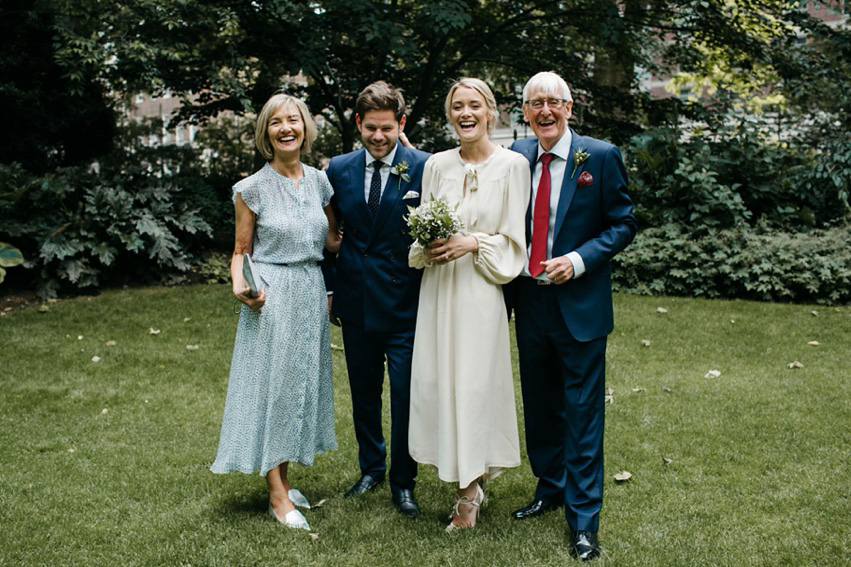 Bride Jess wears an original 1970's vintage Ossie Clarke dress for her Jewish wedding ceremony at Home House in London. Photography by Rebecca Goddard.