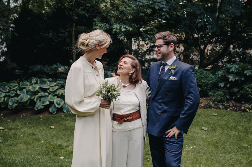 Bride Jess wears an original 1970's vintage Ossie Clarke dress for her Jewish wedding ceremony at Home House in London. Photography by Rebecca Goddard.