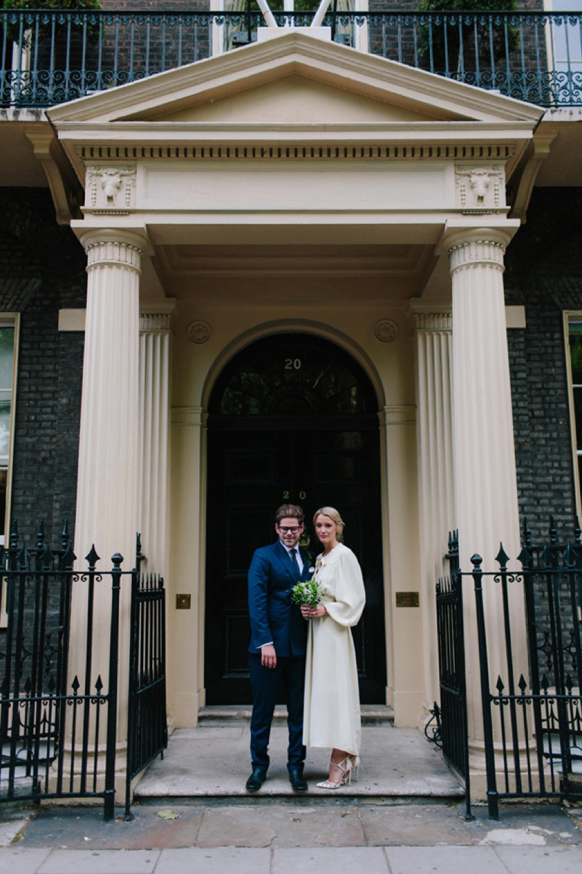 Bride Jess wears an original 1970's vintage Ossie Clarke dress for her Jewish wedding ceremony at Home House in London. Photography by Rebecca Goddard.