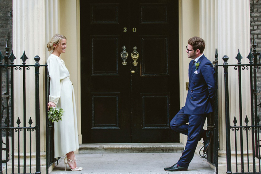 Bride Jess wears an original 1970's vintage Ossie Clarke dress for her Jewish wedding ceremony at Home House in London. Photography by Rebecca Goddard.