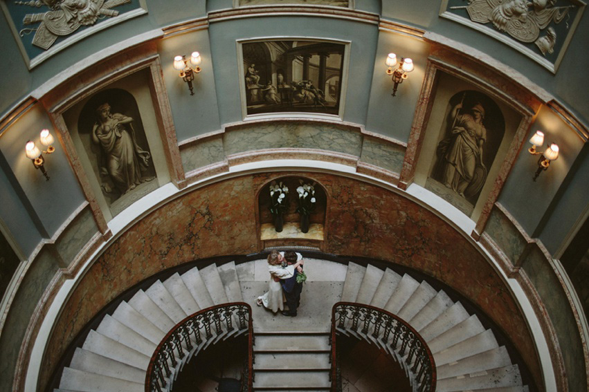 Bride Jess wears an original 1970's vintage Ossie Clarke dress for her Jewish wedding ceremony at Home House in London. Photography by Rebecca Goddard.