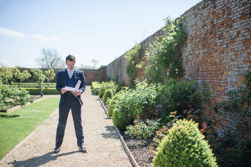 A Theia Couture wedding dress and ostrich feathers for this elegant Babington House wedding. Photography by Ria Mishaal.