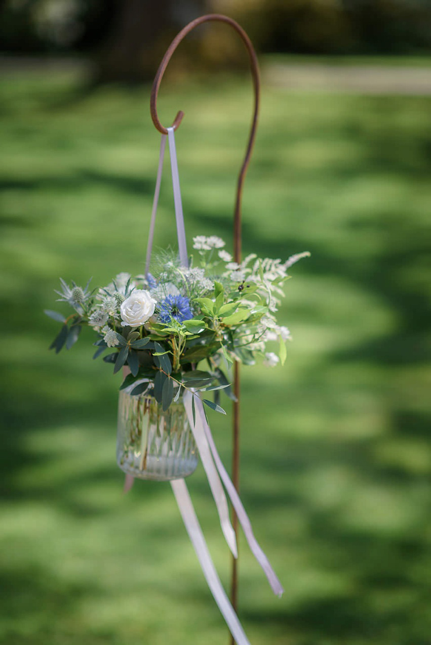 A Theia Couture wedding dress and ostrich feathers for this elegant Babington House wedding. Photography by Ria Mishaal.