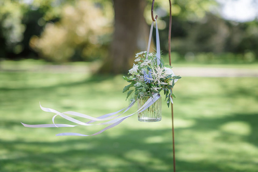 A Theia Couture wedding dress and ostrich feathers for this elegant Babington House wedding. Photography by Ria Mishaal.