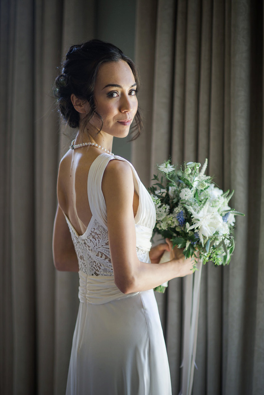 A Theia Couture wedding dress and ostrich feathers for this elegant Babington House wedding. Photography by Ria Mishaal.