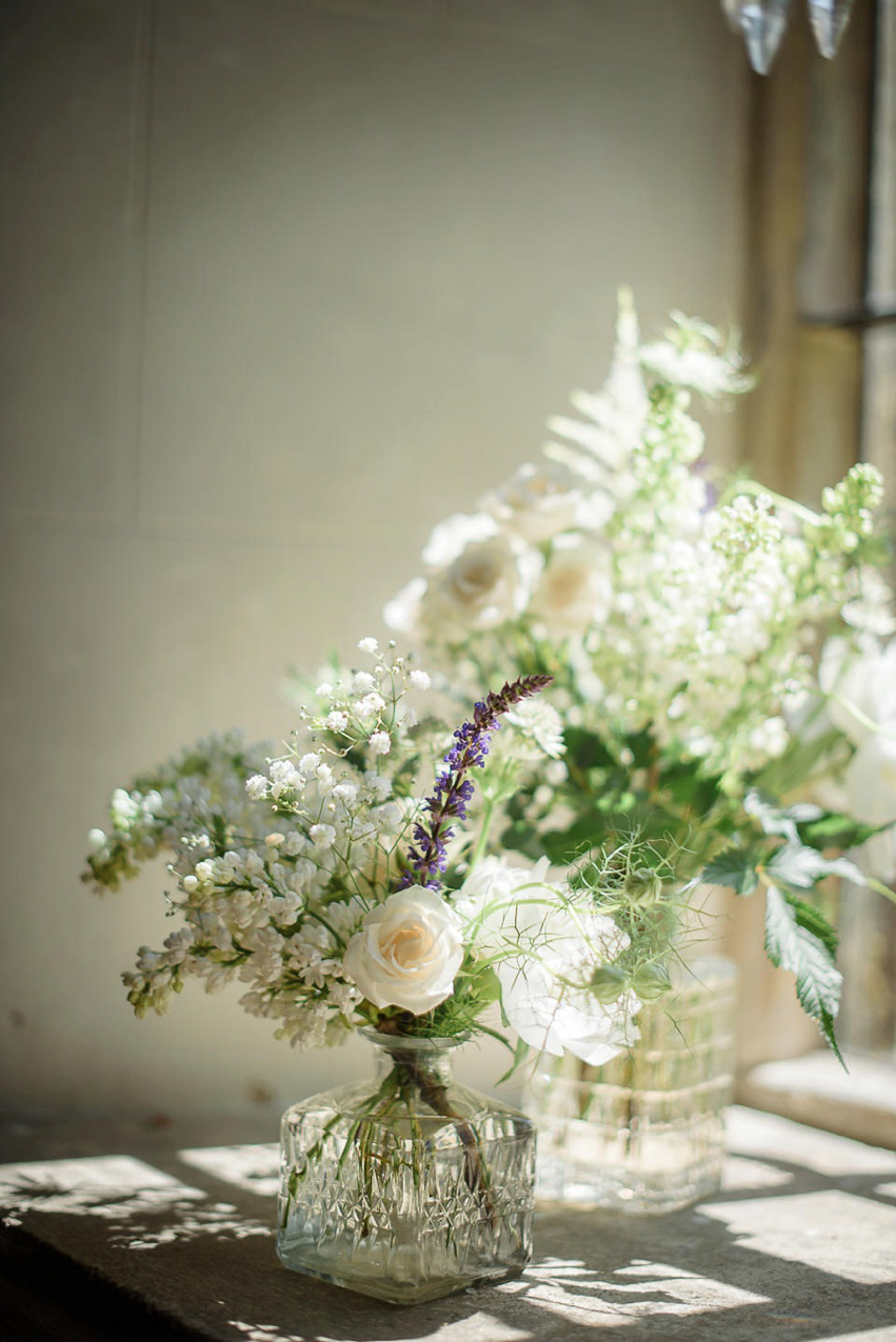 A Theia Couture wedding dress and ostrich feathers for this elegant Babington House wedding. Photography by Ria Mishaal.