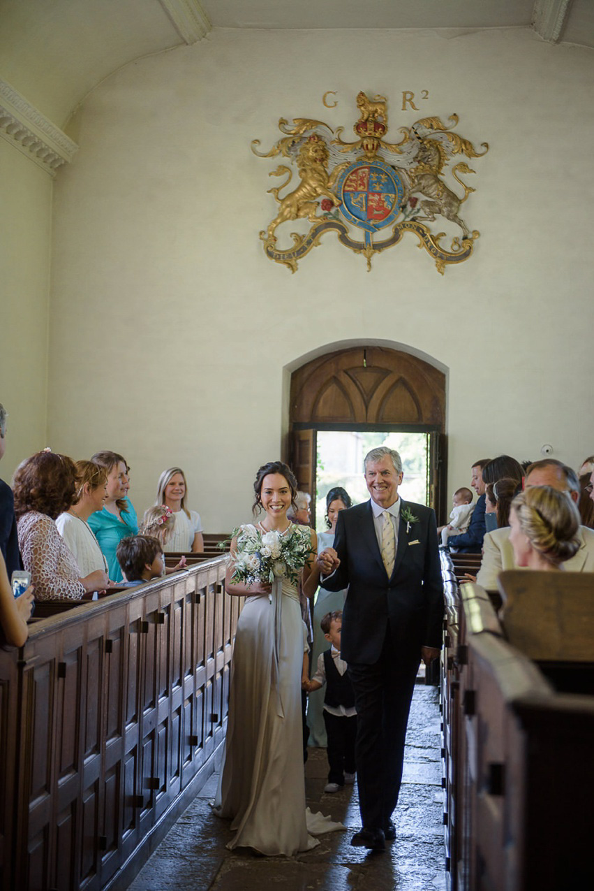 A Theia Couture wedding dress and ostrich feathers for this elegant Babington House wedding. Photography by Ria Mishaal.