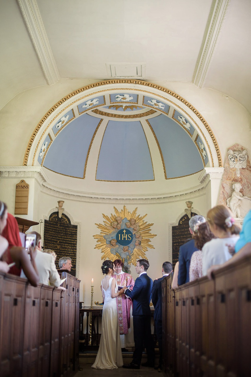 A Theia Couture wedding dress and ostrich feathers for this elegant Babington House wedding. Photography by Ria Mishaal.