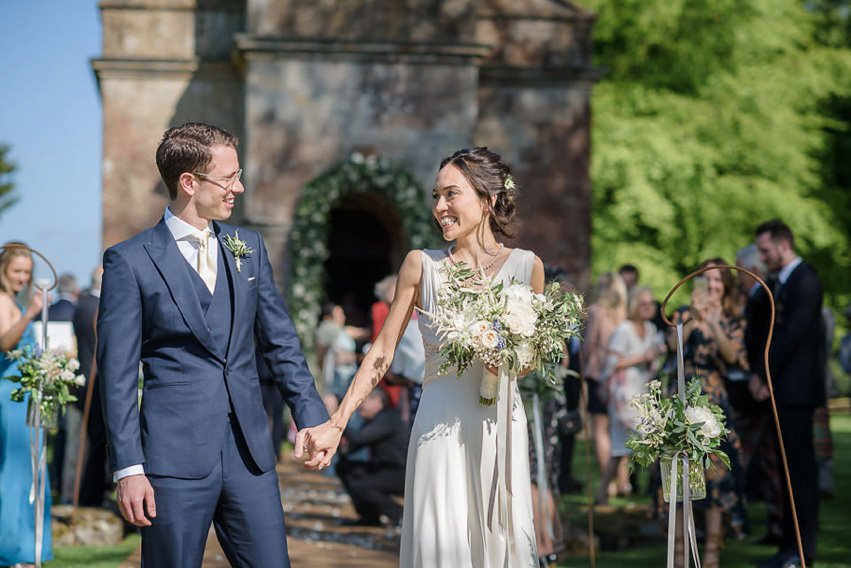 A Theia Couture wedding dress and ostrich feathers for this elegant Babington House wedding. Photography by Ria Mishaal.