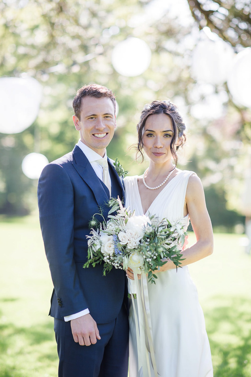 A Theia Couture wedding dress and ostrich feathers for this elegant Babington House wedding. Photography by Ria Mishaal.