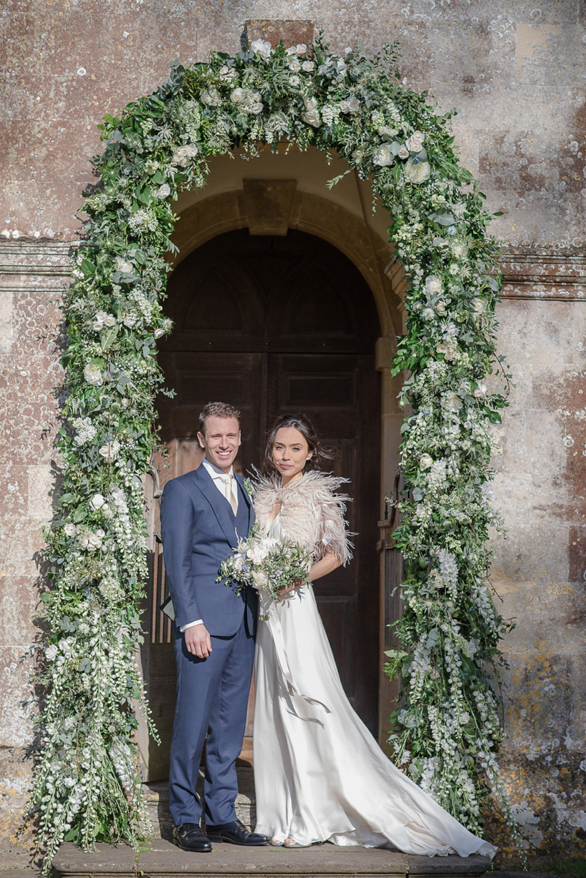 A Theia Couture wedding dress and ostrich feathers for this elegant Babington House wedding. Photography by Ria Mishaal.