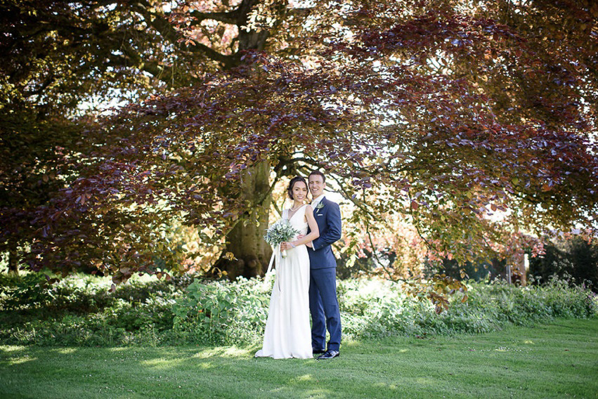 A Theia Couture wedding dress and ostrich feathers for this elegant Babington House wedding. Photography by Ria Mishaal.