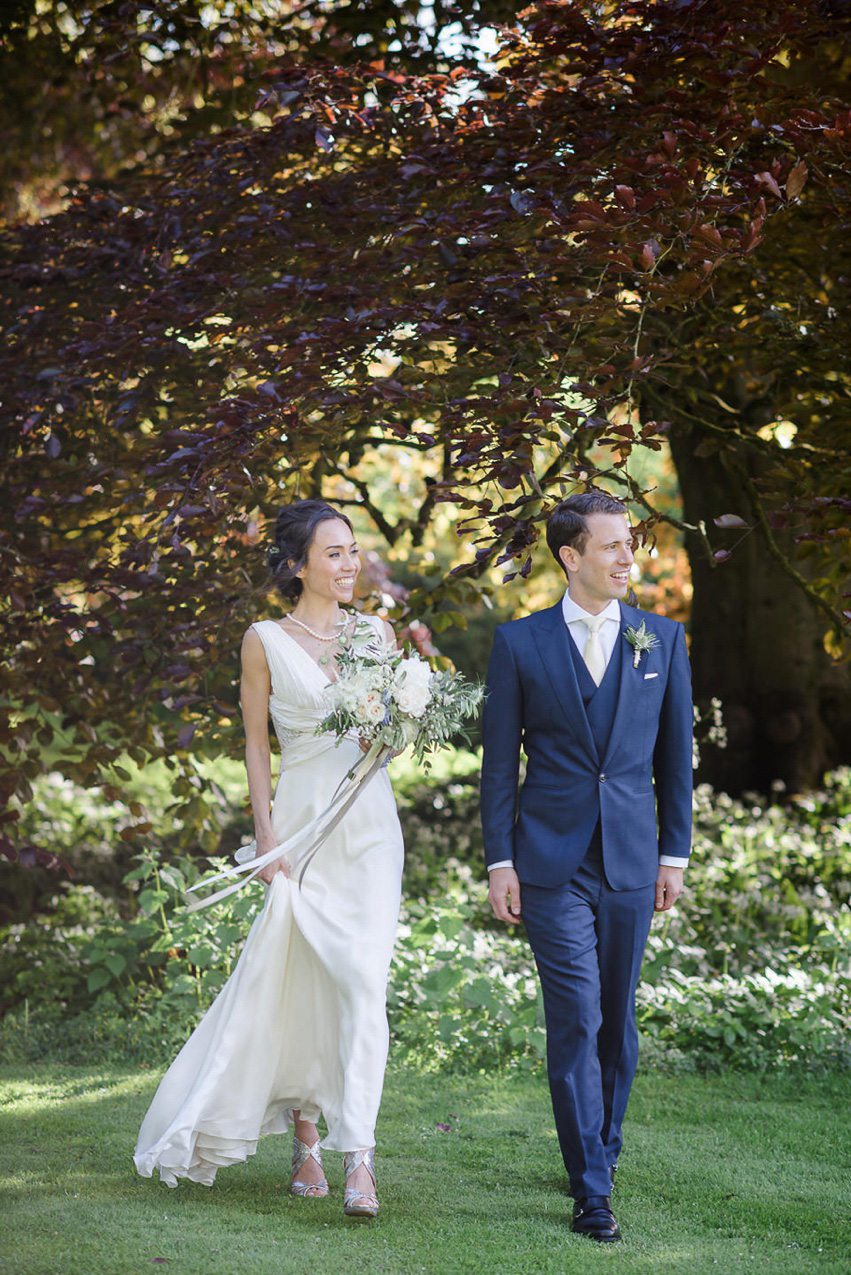 A Theia Couture wedding dress and ostrich feathers for this elegant Babington House wedding. Photography by Ria Mishaal.