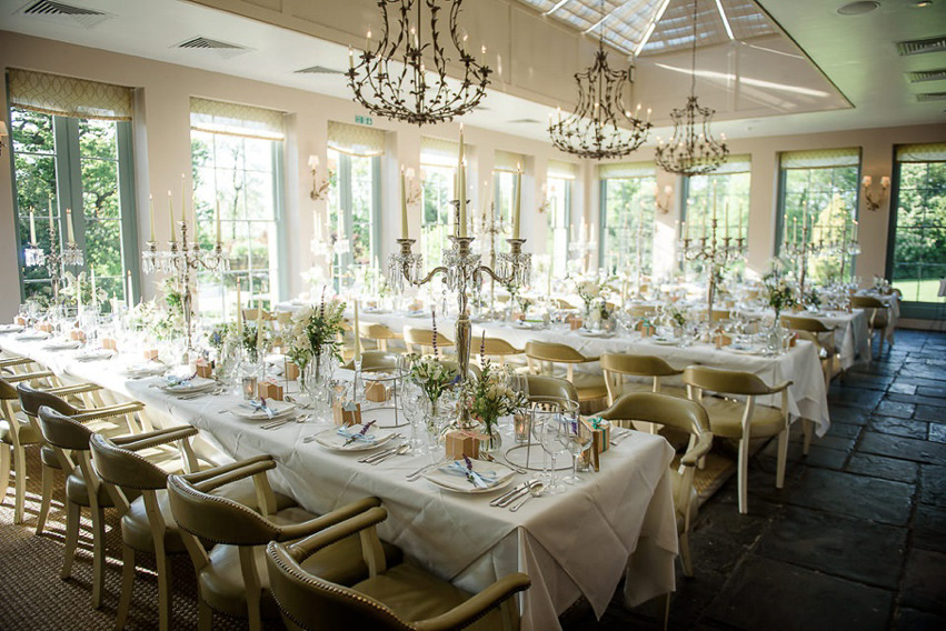 A Theia Couture wedding dress and ostrich feathers for this elegant Babington House wedding. Photography by Ria Mishaal.