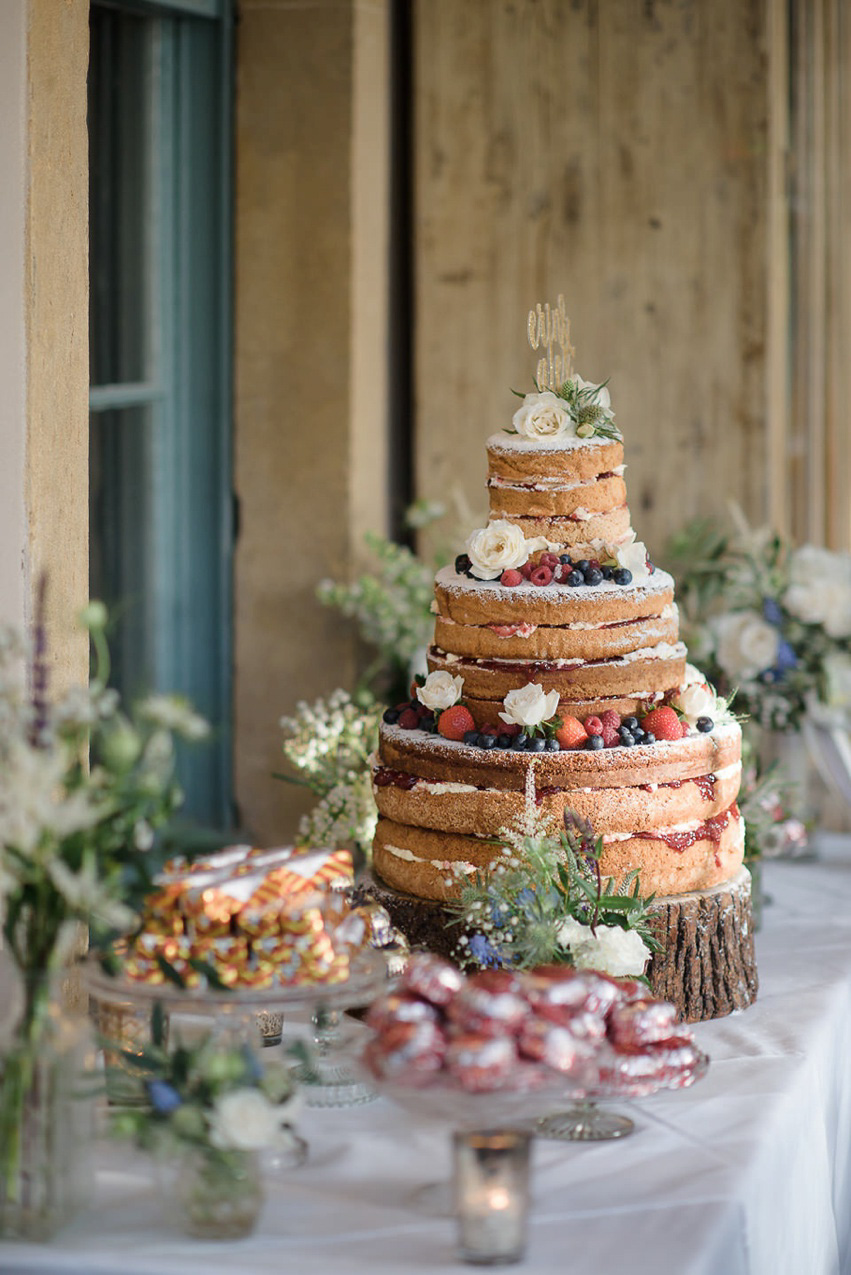 A Theia Couture wedding dress and ostrich feathers for this elegant Babington House wedding. Photography by Ria Mishaal.