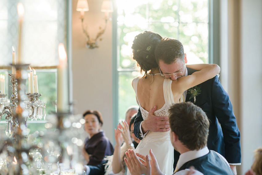 A Theia Couture wedding dress and ostrich feathers for this elegant Babington House wedding. Photography by Ria Mishaal.