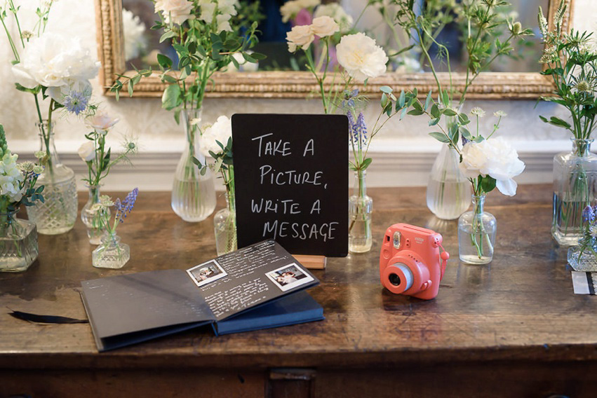 A Theia Couture wedding dress and ostrich feathers for this elegant Babington House wedding. Photography by Ria Mishaal.