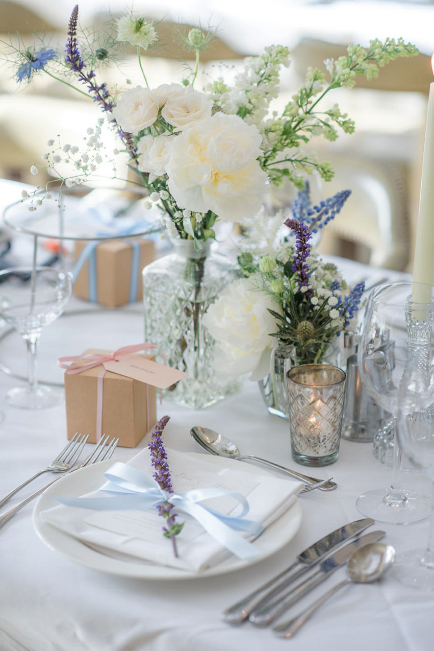 A Theia Couture wedding dress and ostrich feathers for this elegant Babington House wedding. Photography by Ria Mishaal.