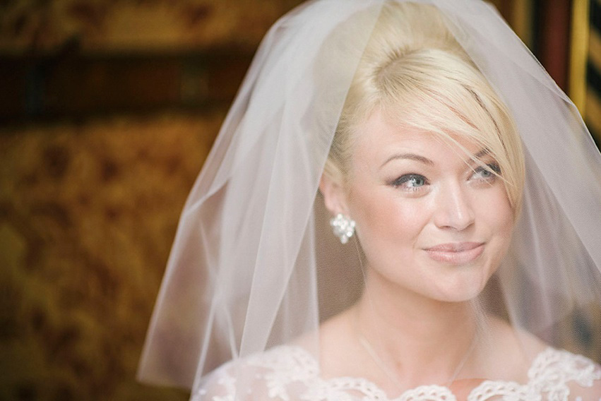 The bride wears a 1950's inspired polka dot dress by Mooshki Bride.  Photography by Kerry Woods.