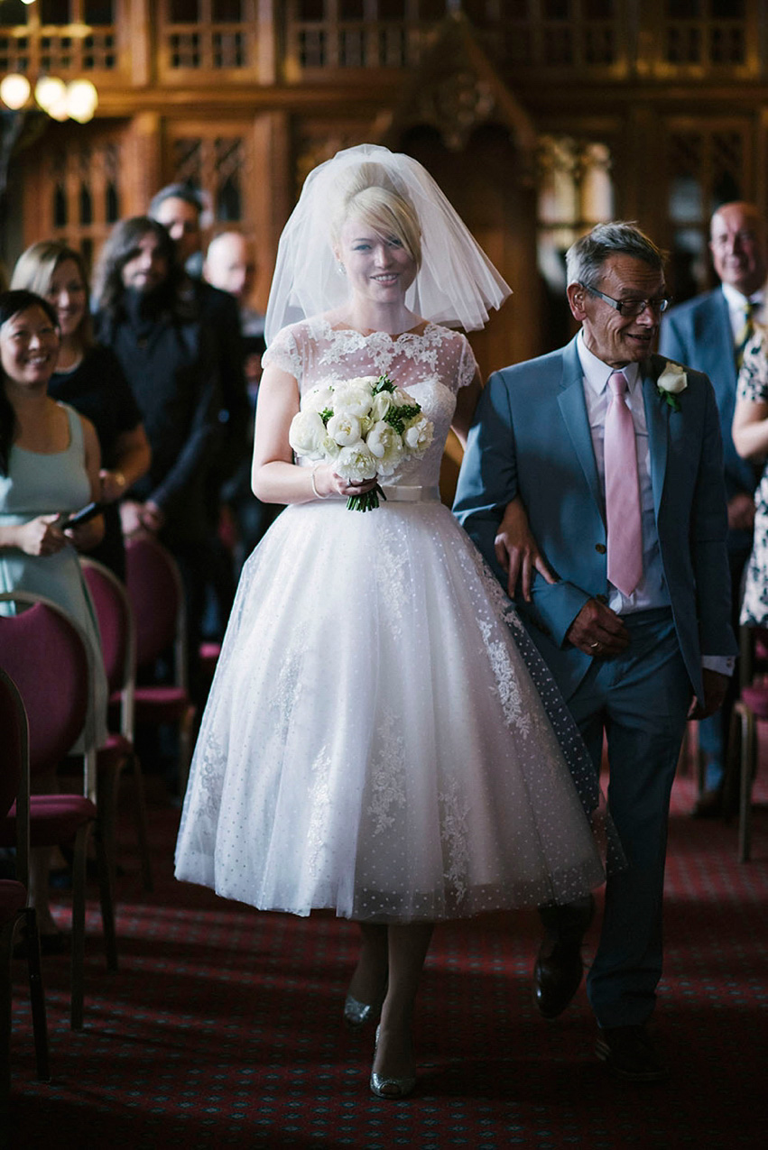 The bride wears a 1950's inspired polka dot dress by Mooshki Bride.  Photography by Kerry Woods.