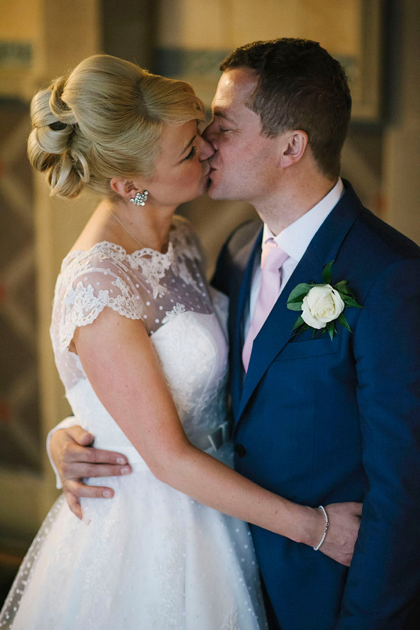 The bride wears a 1950's inspired polka dot dress by Mooshki Bride.  Photography by Kerry Woods.
