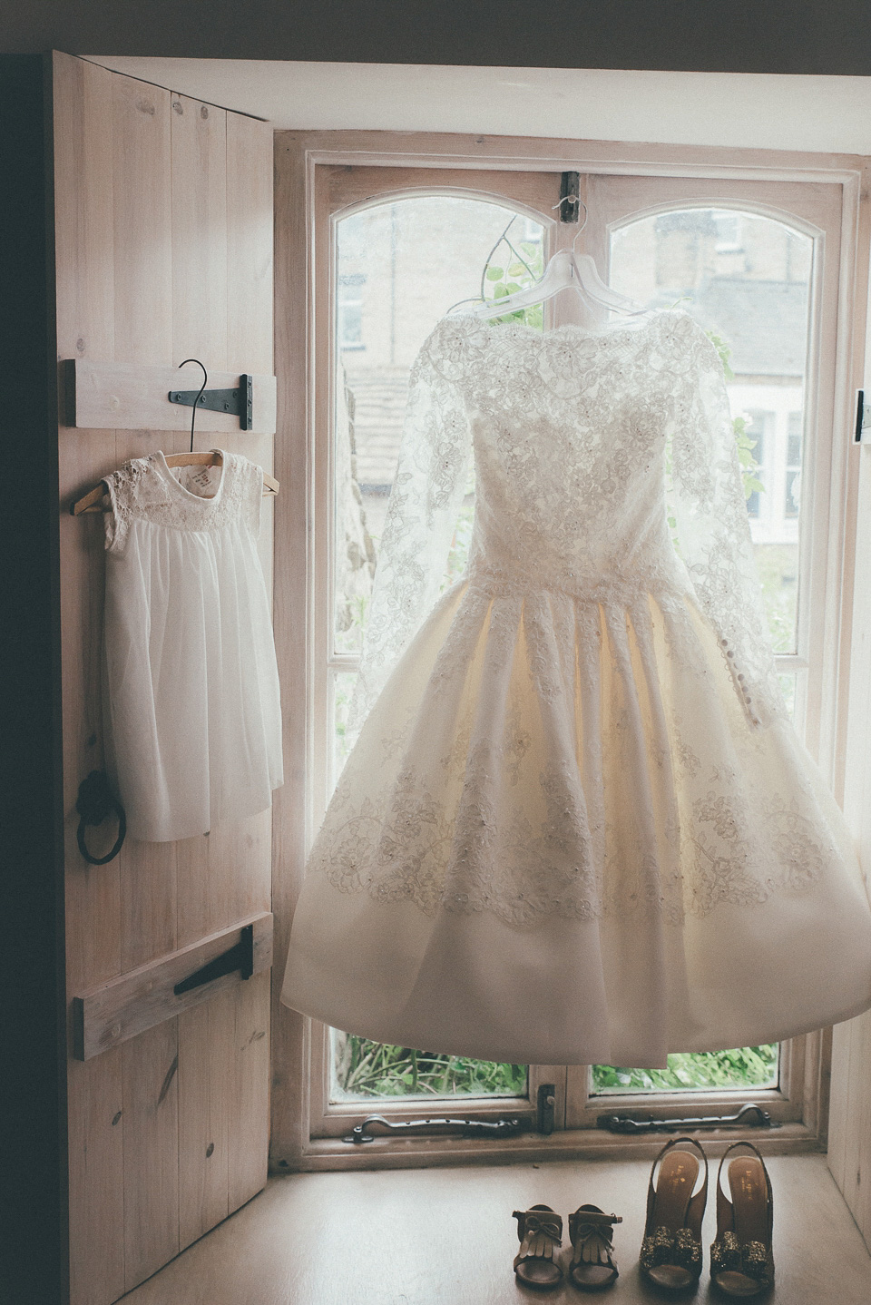 The bride wears a 1950's inspired lace dress for her village hall wedding in Yorkshire. Photography by Shutter Go Click.