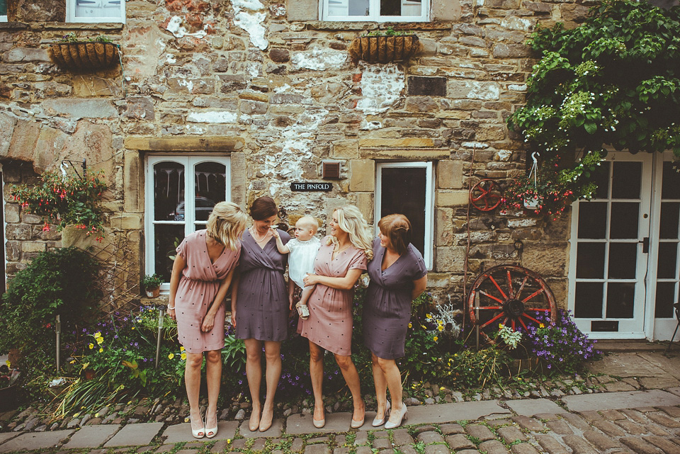 The bride wears a 1950's inspired lace dress for her village hall wedding in Yorkshire. Photography by Shutter Go Click.