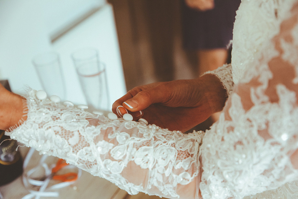 The bride wears a 1950's inspired lace dress for her village hall wedding in Yorkshire. Photography by Shutter Go Click.