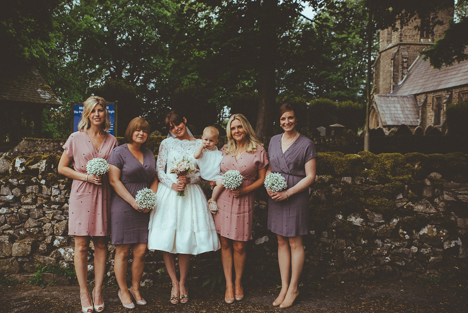 The bride wears a 1950's inspired lace dress for her village hall wedding in Yorkshire. Photography by Shutter Go Click.