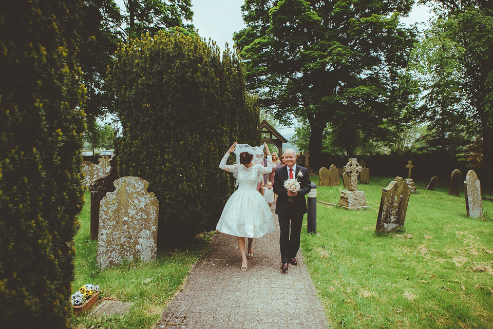 The bride wears a 1950's inspired lace dress for her village hall wedding in Yorkshire. Photography by Shutter Go Click.