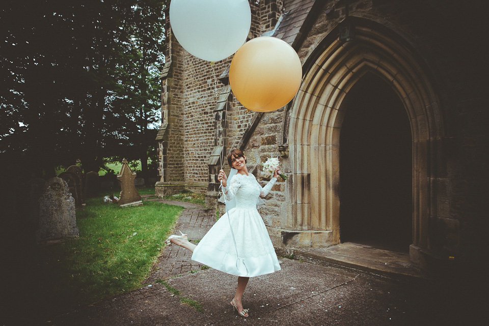 The bride wears a 1950's inspired lace dress for her village hall wedding in Yorkshire. Photography by Shutter Go Click.