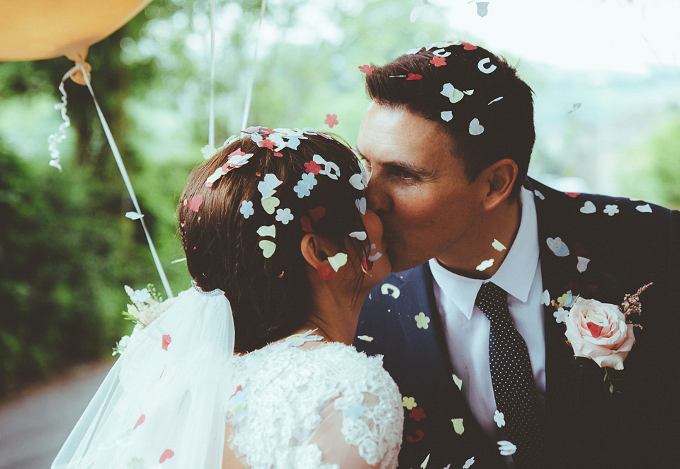 The bride wears a 1950's inspired lace dress for her village hall wedding in Yorkshire. Photography by Shutter Go Click.