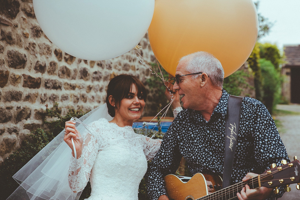 The bride wears a 1950's inspired lace dress for her village hall wedding in Yorkshire. Photography by Shutter Go Click.