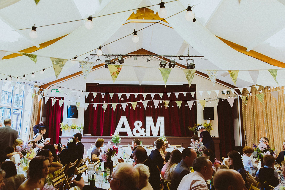 The bride wears a 1950's inspired lace dress for her village hall wedding in Yorkshire. Photography by Shutter Go Click.