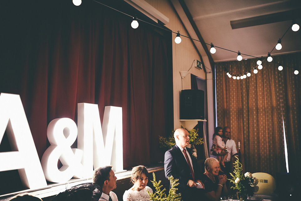 The bride wears a 1950's inspired lace dress for her village hall wedding in Yorkshire. Photography by Shutter Go Click.