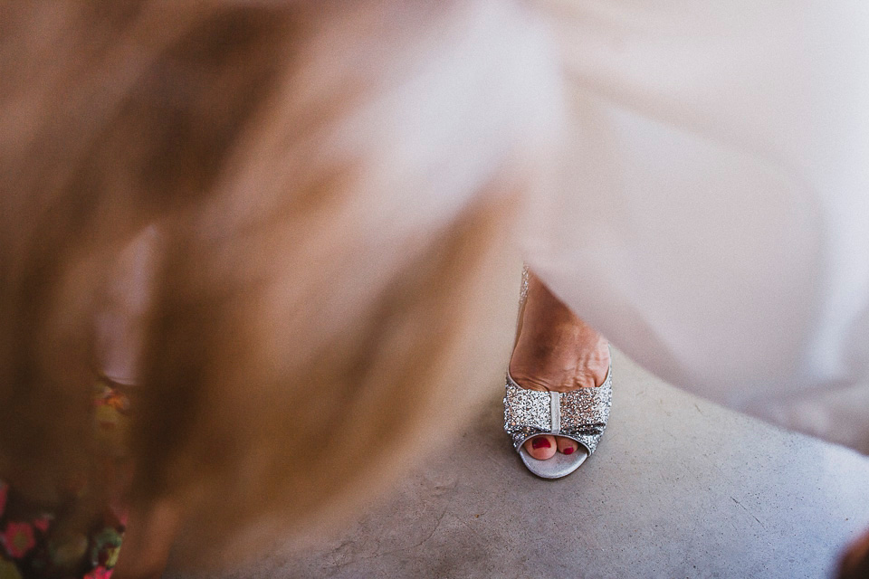 The bride wears Mori Lee for her glamorous rooftop New York wedding. Photography by Forged In The North