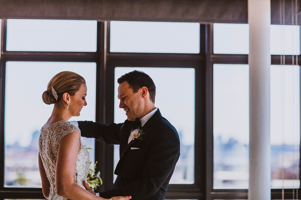 The bride wears Mori Lee for her glamorous rooftop New York wedding. Photography by Forged In The North