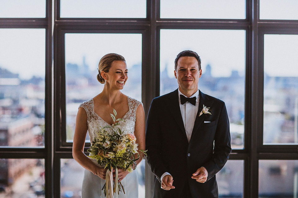 The bride wears Mori Lee for her glamorous rooftop New York wedding. Photography by Forged In The North