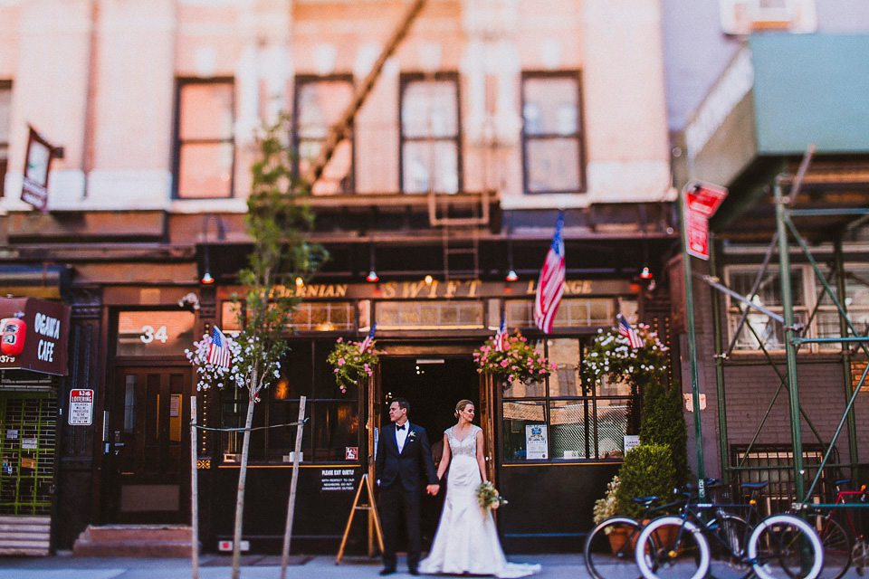 The bride wears Mori Lee for her glamorous rooftop New York wedding. Photography by Forged In The North