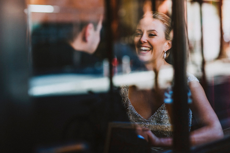 The bride wears Mori Lee for her glamorous rooftop New York wedding. Photography by Forged In The North