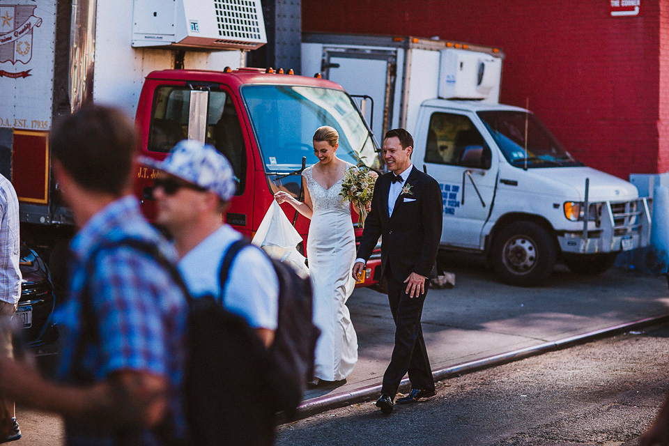 The bride wears Mori Lee for her glamorous rooftop New York wedding. Photography by Forged In The North