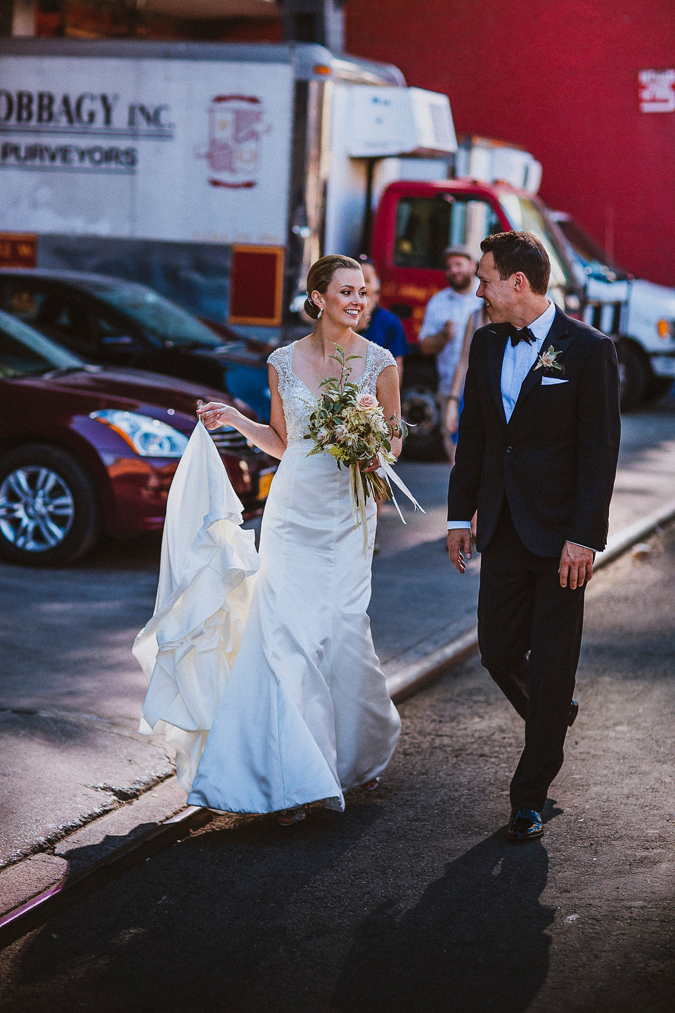 The bride wears Mori Lee for her glamorous rooftop New York wedding. Photography by Forged In The North