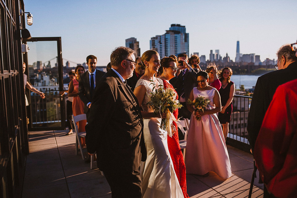 The bride wears Mori Lee for her glamorous rooftop New York wedding. Photography by Forged In The North