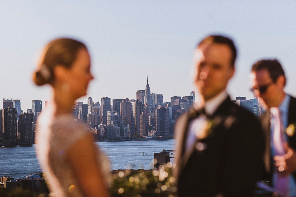 The bride wears Mori Lee for her glamorous rooftop New York wedding. Photography by Forged In The North