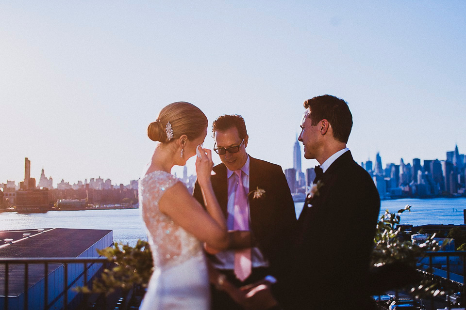 The bride wears Mori Lee for her glamorous rooftop New York wedding. Photography by Forged In The North